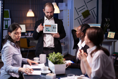 A SEO specialist showing improved  results to their customer after white label support received from us